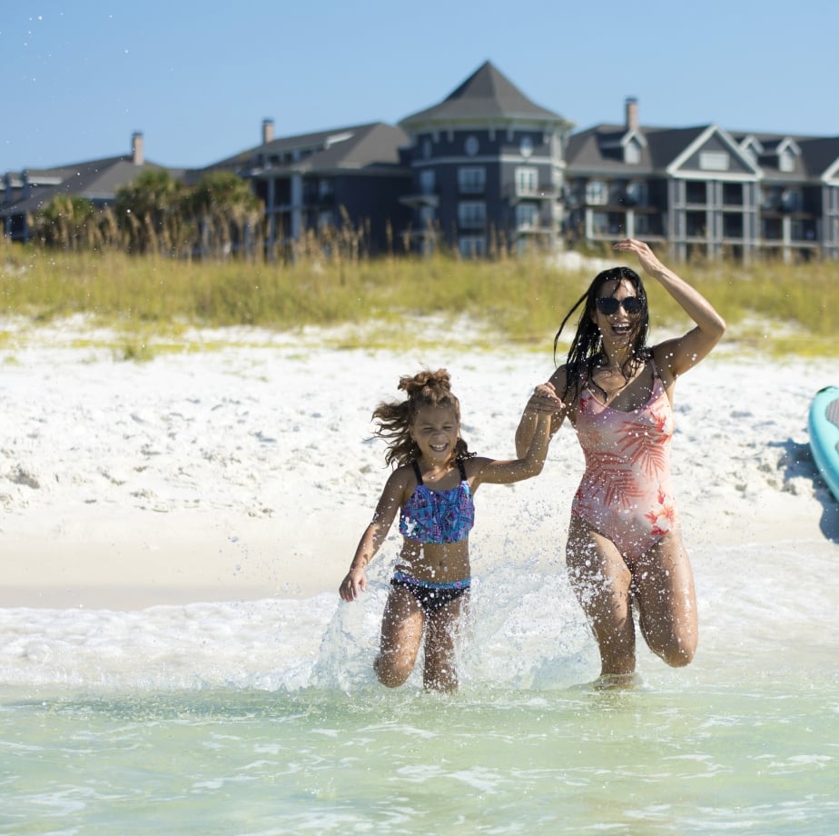 mom daughter in the surf